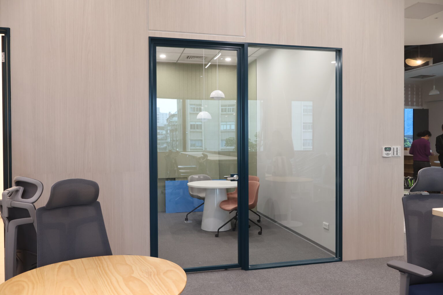 Glass partition meeting room with double glass doors