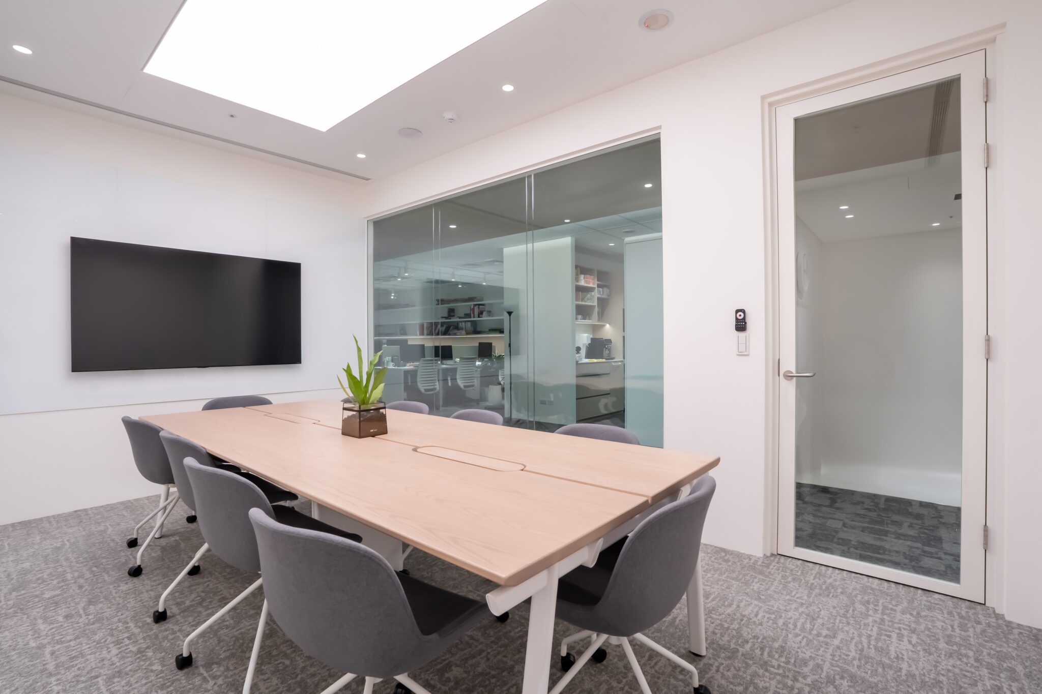 Meeting room interior with glass partition wall and door