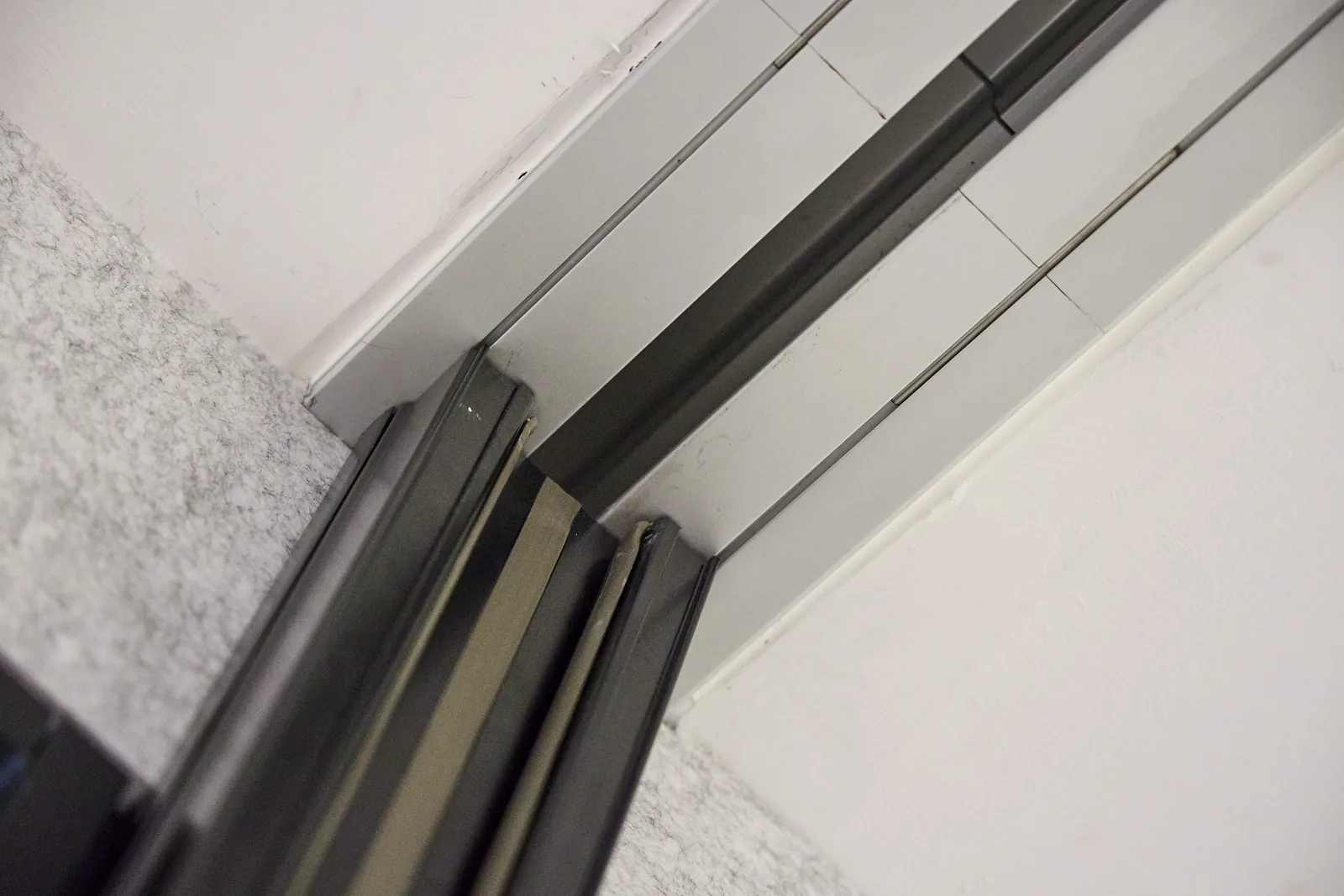 Detail of a movable wall panel meeting the ceiling track