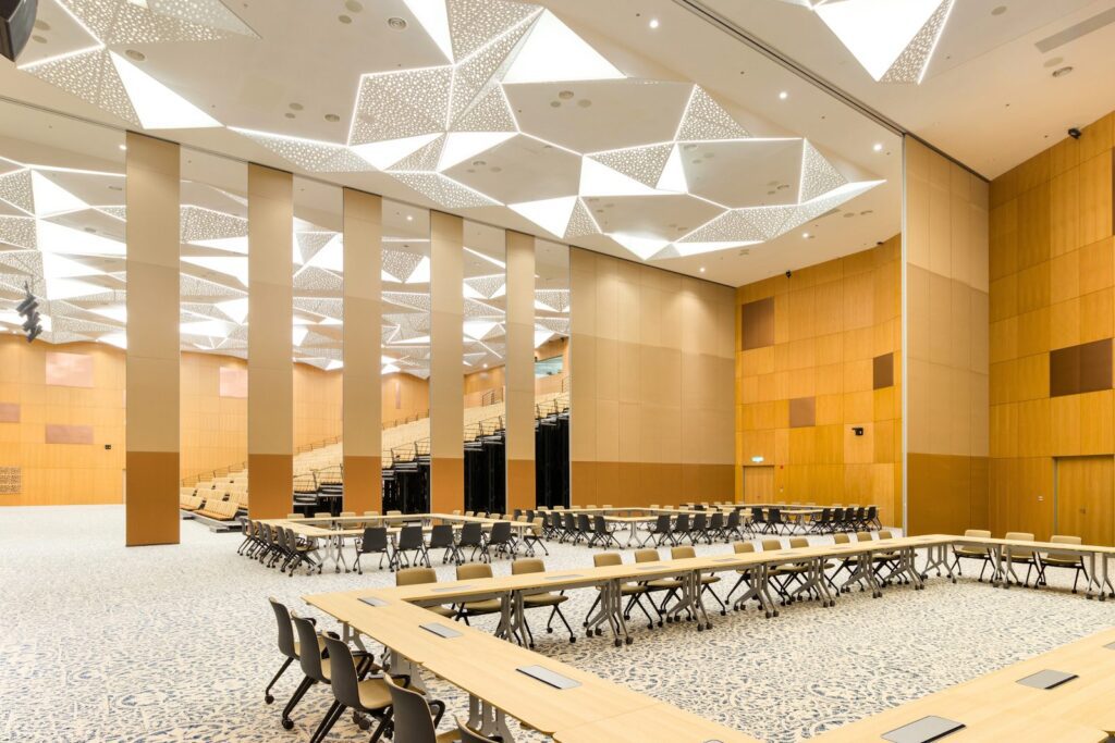 IWC BOZ solid operable wall extended to divide a high volume hall